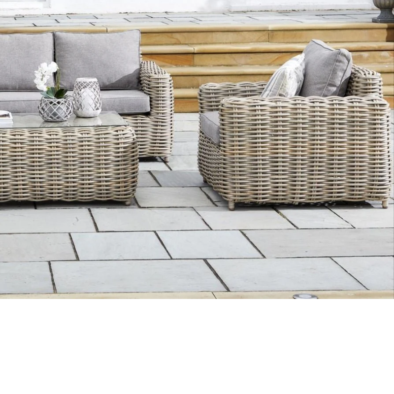 Outdoor patio furniture set with rattan chairs and coffee table
