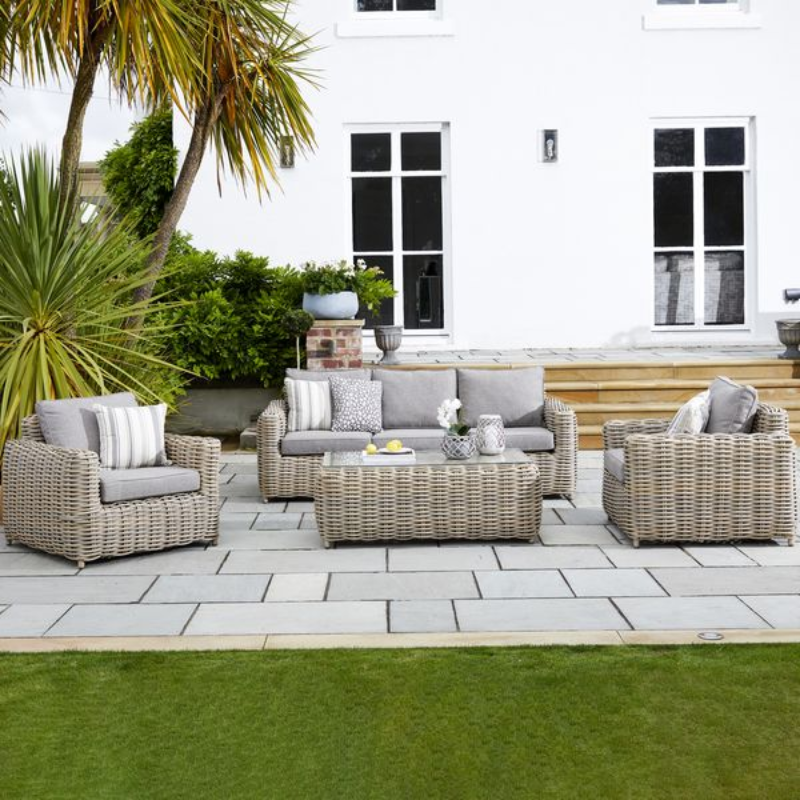 Outdoor sofa, two chairs and coffee table.