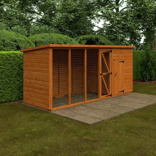 Wooden pet run or kennel with a door open, set against a green garden backdrop.