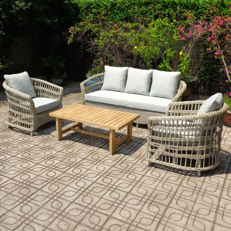Outdoor patio set with wicker chairs, sofa, cushions and wooden table 