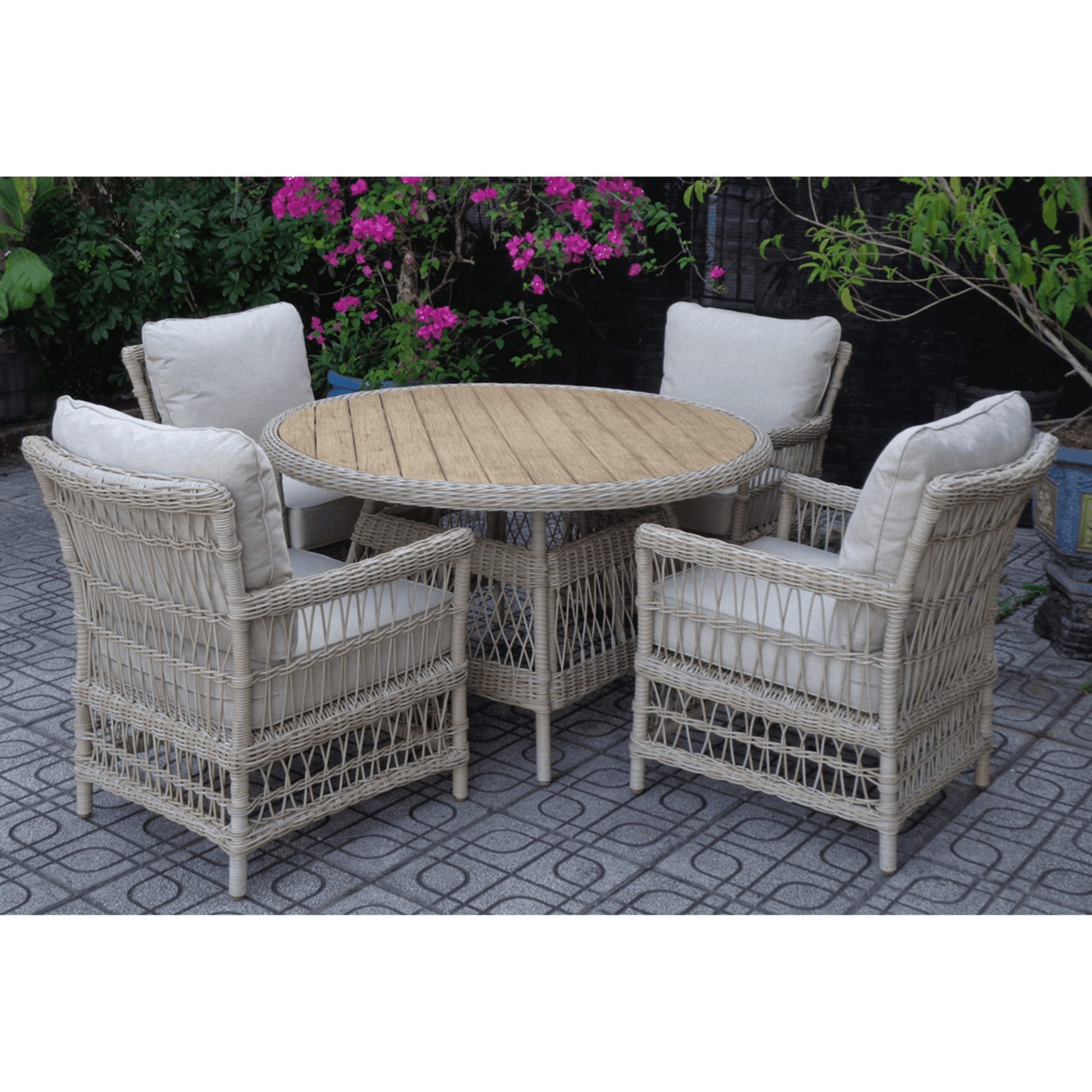 Outdoor patio set with round table and four chairs on a patio